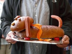 photo of a dog made out of sausages and bread